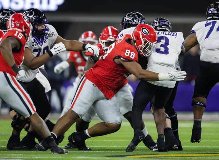 Jan 9, 2023; Inglewood, CA, USA; Georgia Bulldogs defensive lineman Jalen Carter (88) tackles TCU Horned Frogs running back Emari Demercado (3) during the CFP national championship game at SoFi Stadium. Mandatory Credit: Mark J. Rebilas-USA TODAY Sports